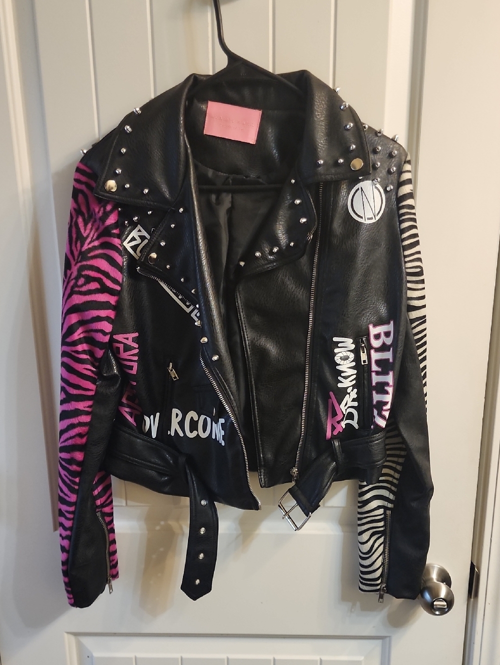 Black Faux Leather Studded Motorcycle Jacket with Pink & White Zebra Panels